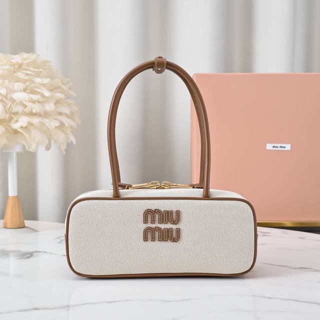 5Bb173: Miu's New Canvas Bowling Bag Features A Brand-New Canvas Fabric Paired W