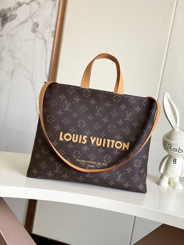 M13928 As Part Of The Lv Packaging Series, The Shopper Tote Handbag Reinterprets