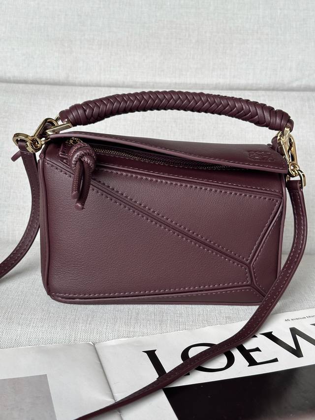 Genuine Leather Mini Smooth Calf Leather Puzzle Handbag Puzzle Features A Distin