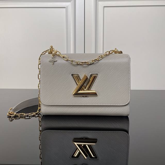 Top-Tier Original M21025 Gray 0 This Twist Medium-Sized Handbag Is Crafted From
