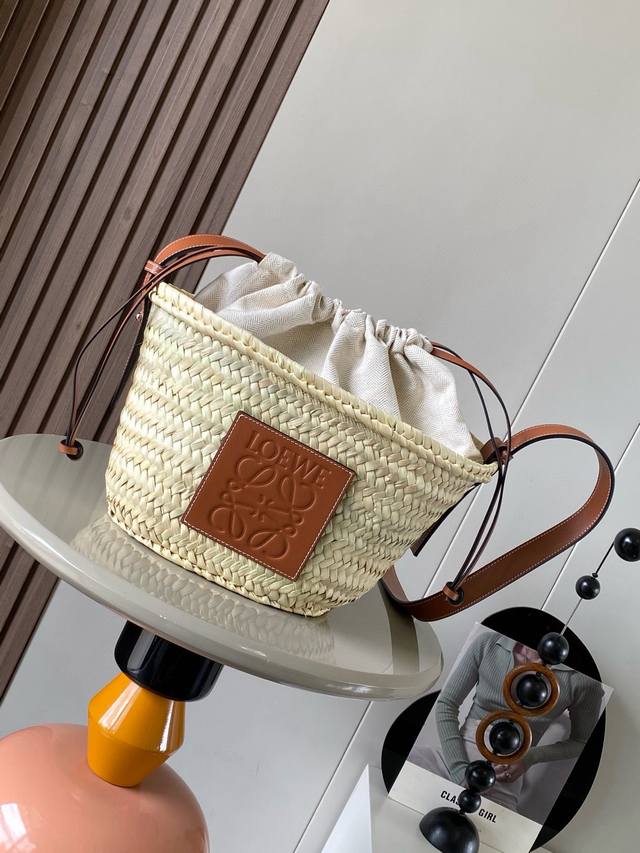 Palm Leaf And Leather Drawstring Bucket Bag This Classic Bucket Bag Features A H