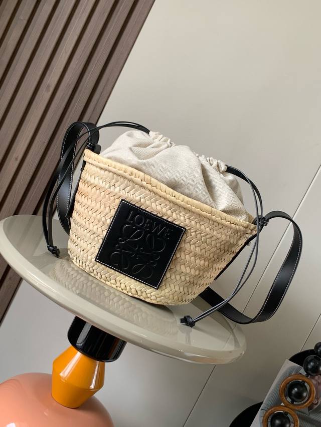 Palm Leaf And Leather Drawstring Bucket Bag This Classic Bucket Bag Features A H