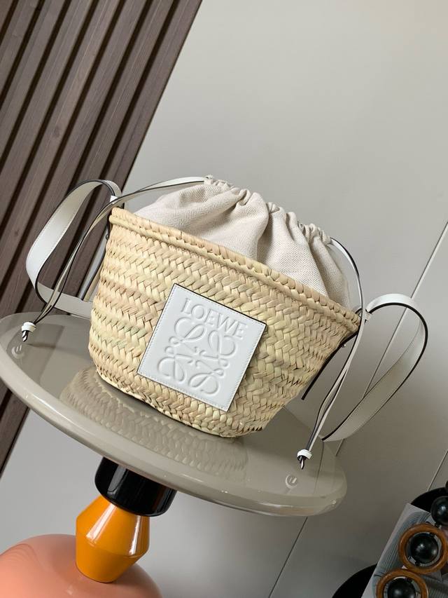 Palm Leaf And Leather Drawstring Bucket Bag This Classic Bucket Bag Features A H