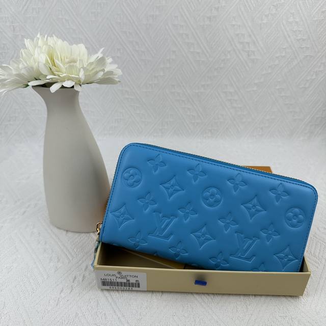 M81511 Blue Crafted From Padded Monogram-Embossed Lambskin, Perfectly Complement