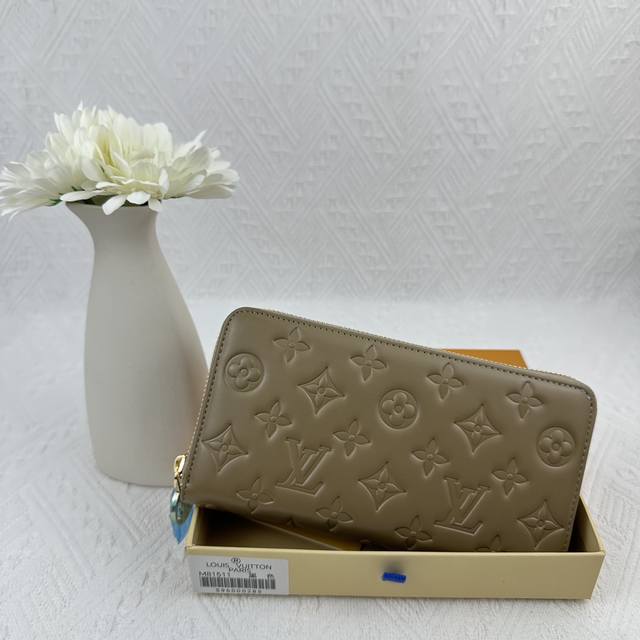 M81511 Gray Crafted From Padded Monogram-Embossed Lambskin, Perfectly Complement