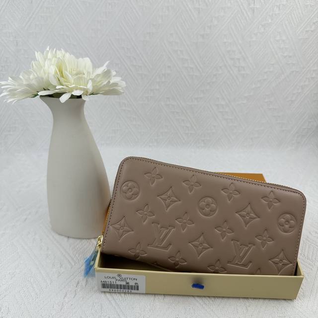 M81511 Apricot Crafted From Padded Monogram-Embossed Lambskin, Perfectly Complem