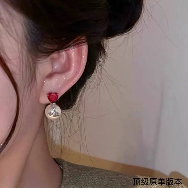 The Empress Dowager's Pearls Are Paired With Heart-Shaped Crystal Earrings. They
