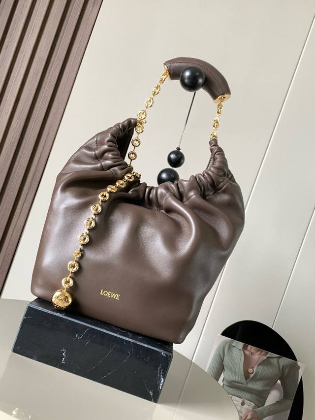 The Same Small Nappa Leather Squeeze Handbag As The Celebrity Style Is A Delicat