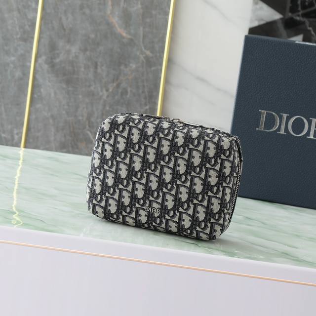 This Travel Clutch Is Practical And Stylish. Crafted From Beige And Black Obliqu