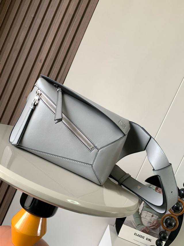 New Small Classic Cow Leather Puzzle Waist Bag. The Rectangular Shape And Precis