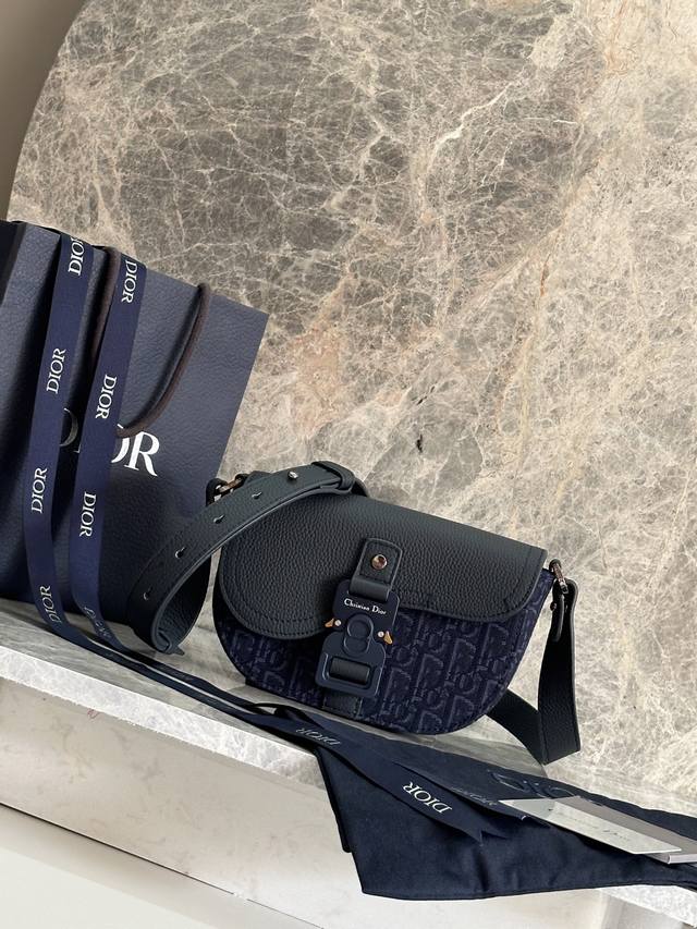 This Saddle Clutch With Shoulder Strap Is A New Piece From The Spring 2025 Men's