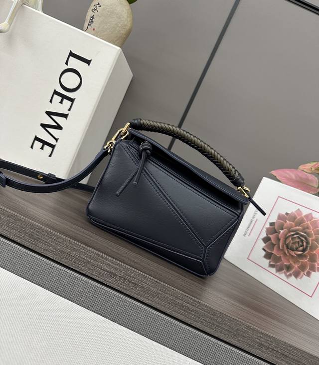 Low Mini Smooth Cowhide Puzzle Handbag With Unique Geometric Lines To Outline Th