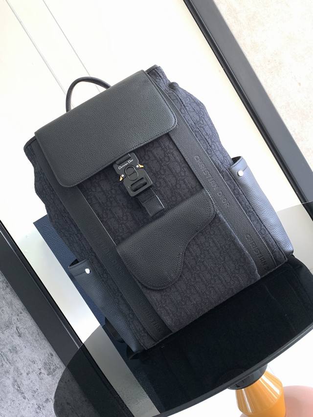 This Saddle-Style Backpack Is Both Practical And Elegant. Crafted From Black Obl