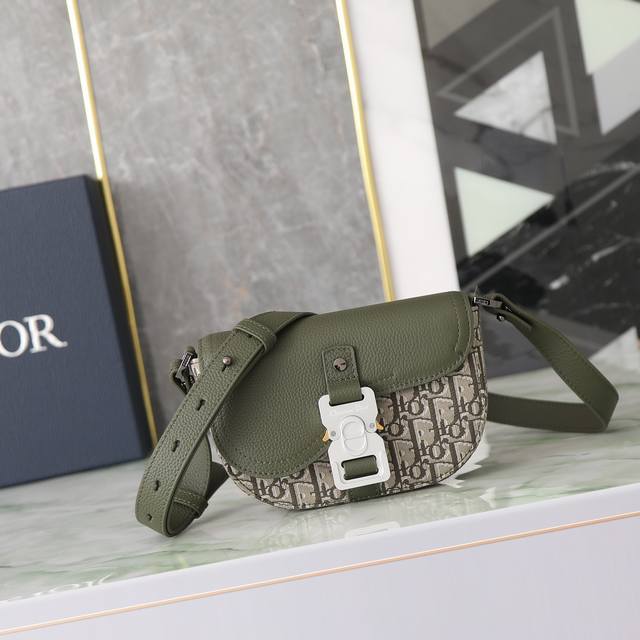 This Saddle Messenger Bag Features A Modern Design With A Flap Closure, Exuding