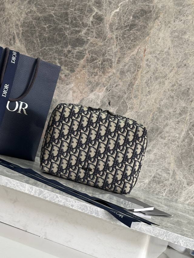 This Travel Clutch Is Both Practical And Stylish.Crafted From Beige And Black Ob