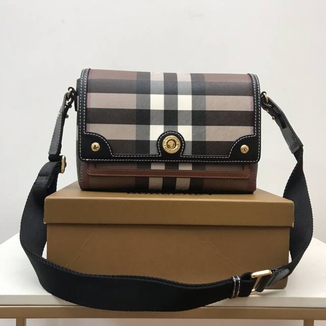 B's Compact Crossbody Bag Features A Logo-Engraved Snap Closure. It Comes With A