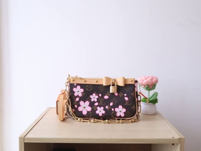 M13666 Cherry Blossom This Pochette Accessoires Handbag Combines Classic Monogra