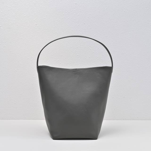 Upgraded Steel-Stamped Logo In Large Lychee Gray, Tr Bucket Bag. The Leather Is