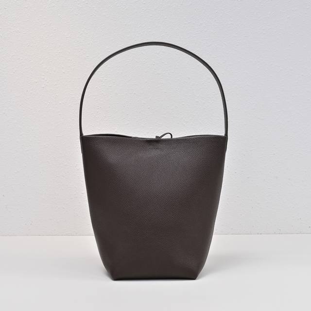 Upgraded Steel-Stamped Logo Medium-Textured Ebony Color Tr Bucket Bag. The Leath
