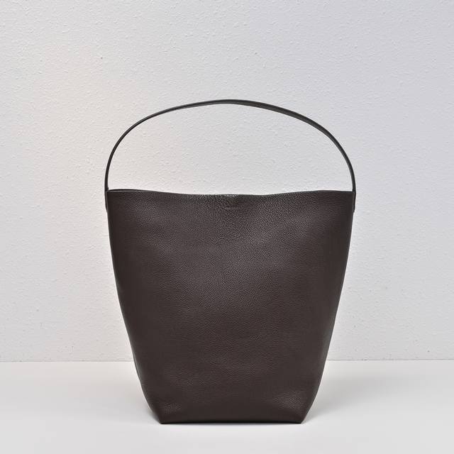 Upgraded Steel-Stamped Logo In Large Lychee Ebony Color, Tr Bucket Bag. The Leat