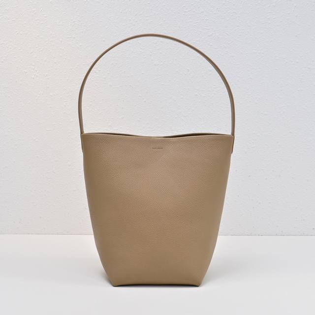 Upgraded Steel-Stamped Logo In Medium Lychee Milk Tea Color, Tr Bucket Bag. The