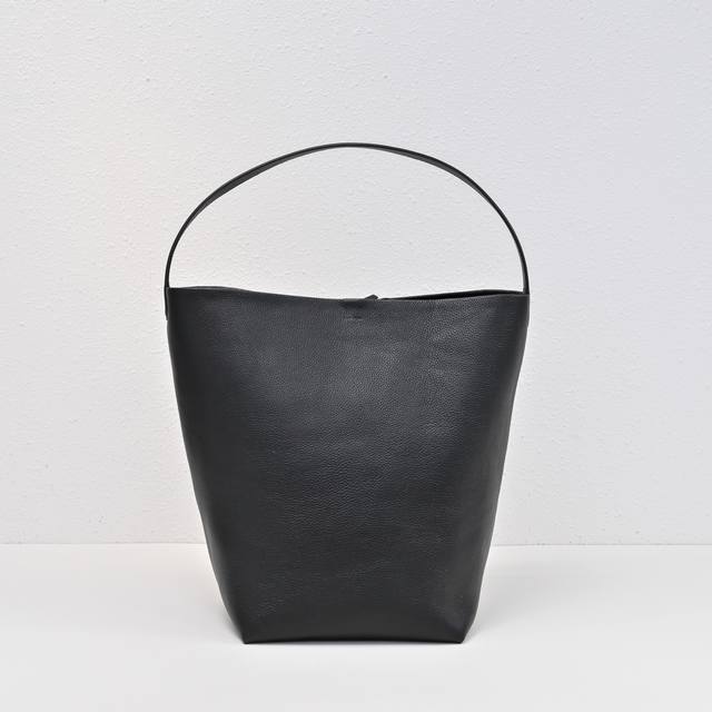 Upgraded Steel-Stamped Logo In Large Black, Tr Bucket Bag. The Leather Is Both A