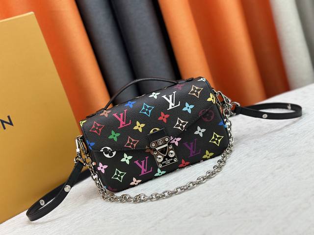 M12429 M46279 This Pochette M Tis East West Handbag Draws Inspiration From The B