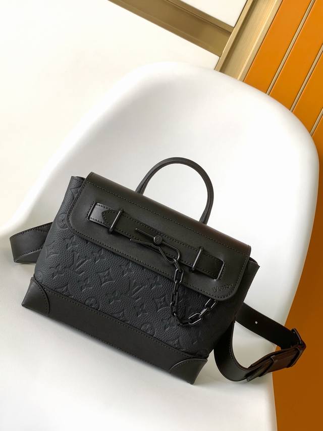 M24436 This Steamer Small Handbag Features Soft Monogram-Embossed Taurillon Leat
