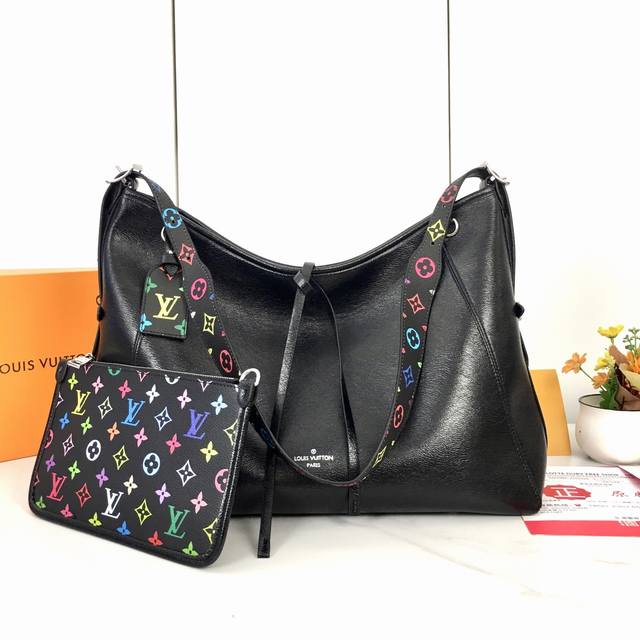M13105. The Large Louis Vuitton Carryall Medium Handbag Features A Monogram Canv