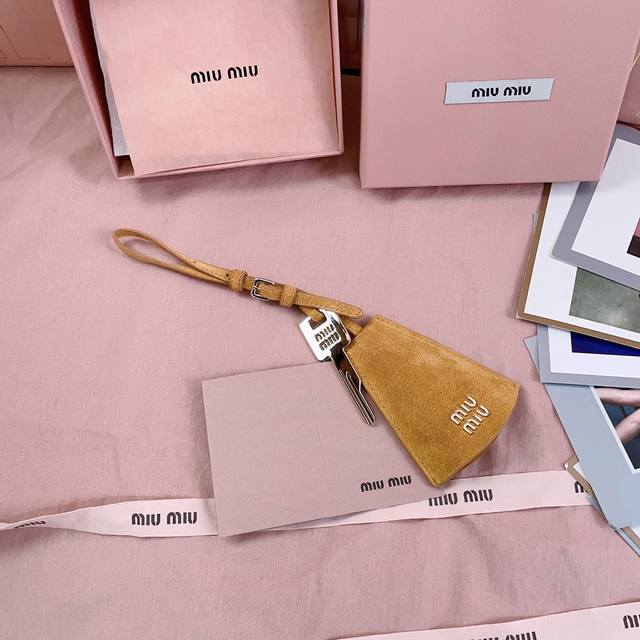 Authentic Grade 5Dn003: Miu M Earphone Mini Pendant. This Year's Miu M Bag Theme