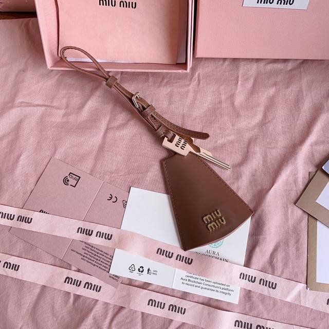 Authentic Grade 5Dn003: Miu M Earphone Mini Pendant. This Year's Miu M Bag Theme