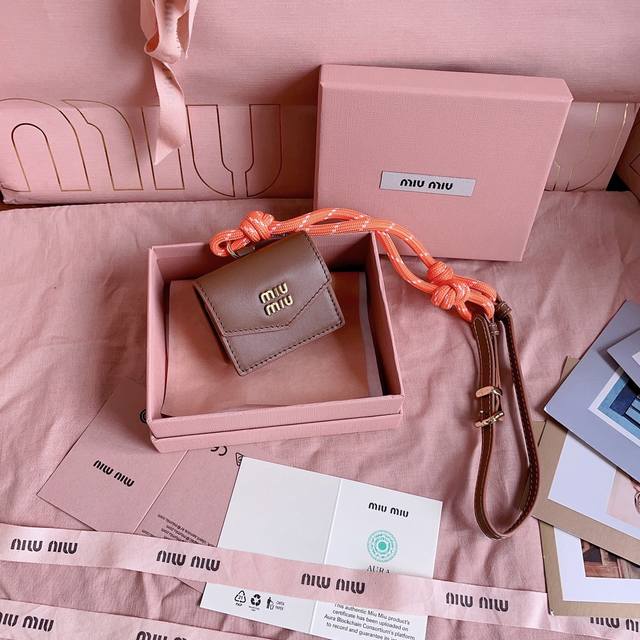 Authentic Grade 5Dn002: Miu M Earphone Mini Pendant. This Year's Miu M Bag Theme