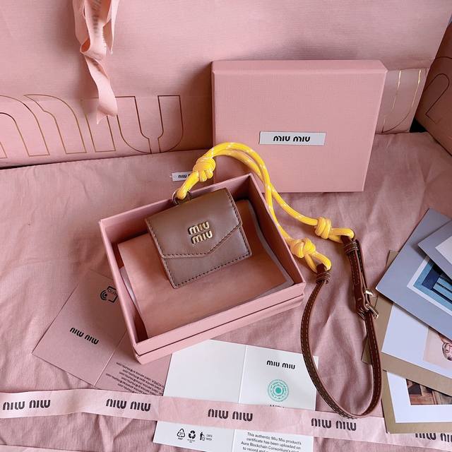 Authentic Grade 5Dn002: Miu M Earphone Mini Pendant. This Year's Miu M Bag Theme