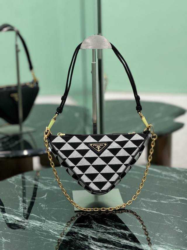 Twin Triangle Bag First Seen In Mario's Travel Trunk, It Has Been Reinterpreted