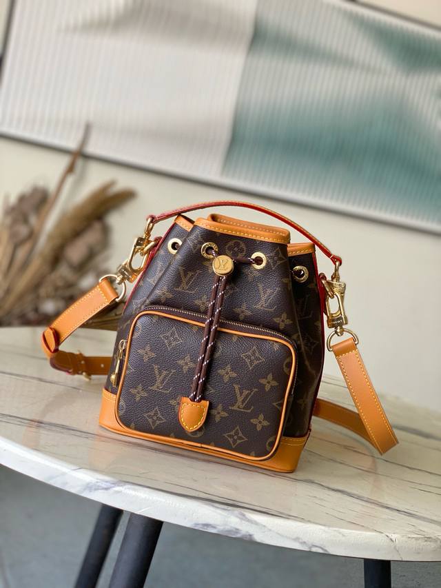 Top Original M14017 Noe Cargo Bucket Bag Is Made Of Monogram Canvas With Distres