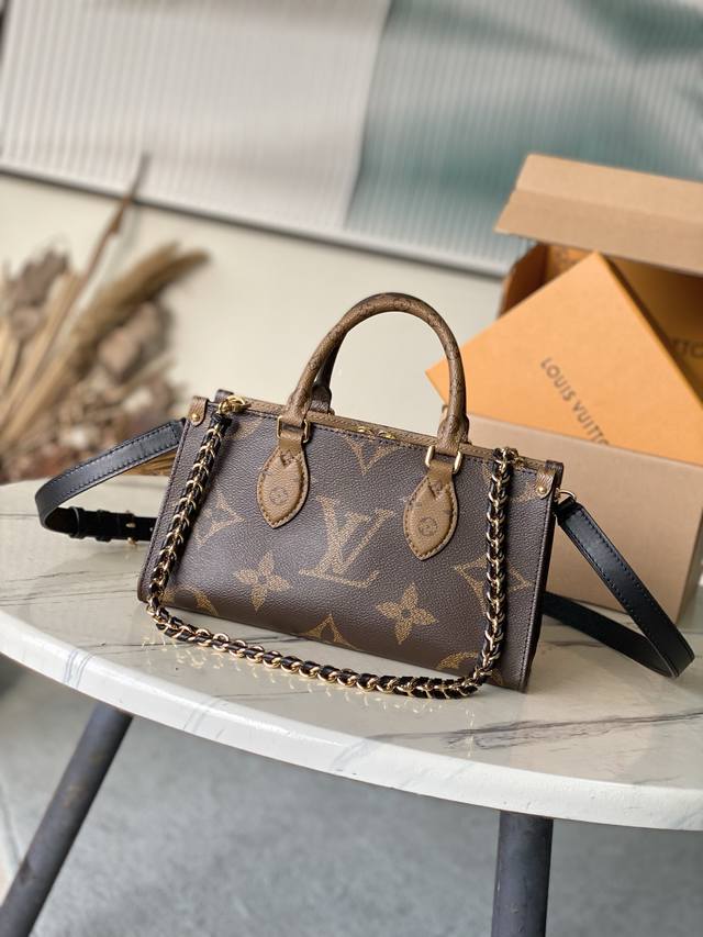 Top Original M14236 This Onthego East West Bag Is Made Of Coated Canvas. The Mon