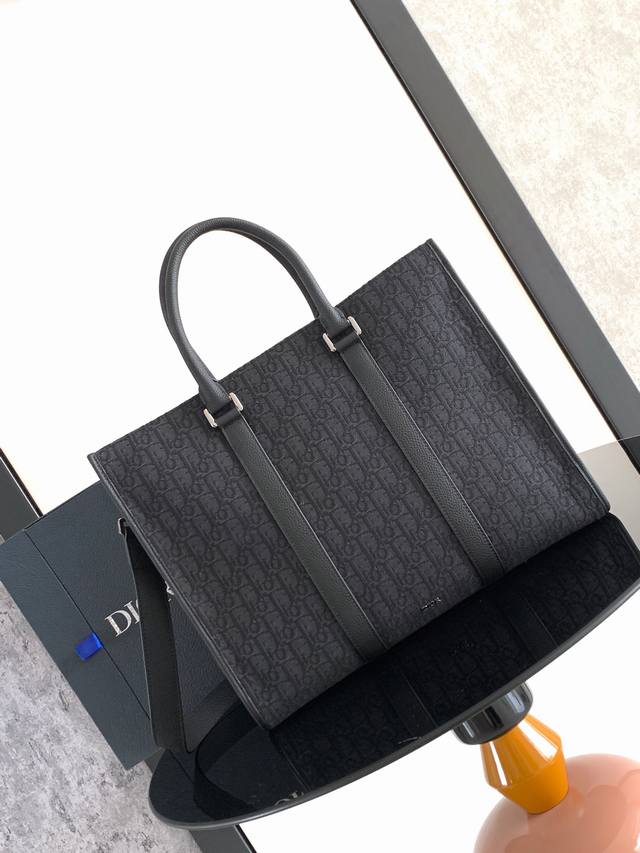 the East-West Bag Exudes Timeless Elegancecrafted In Black Oblique Printa New
