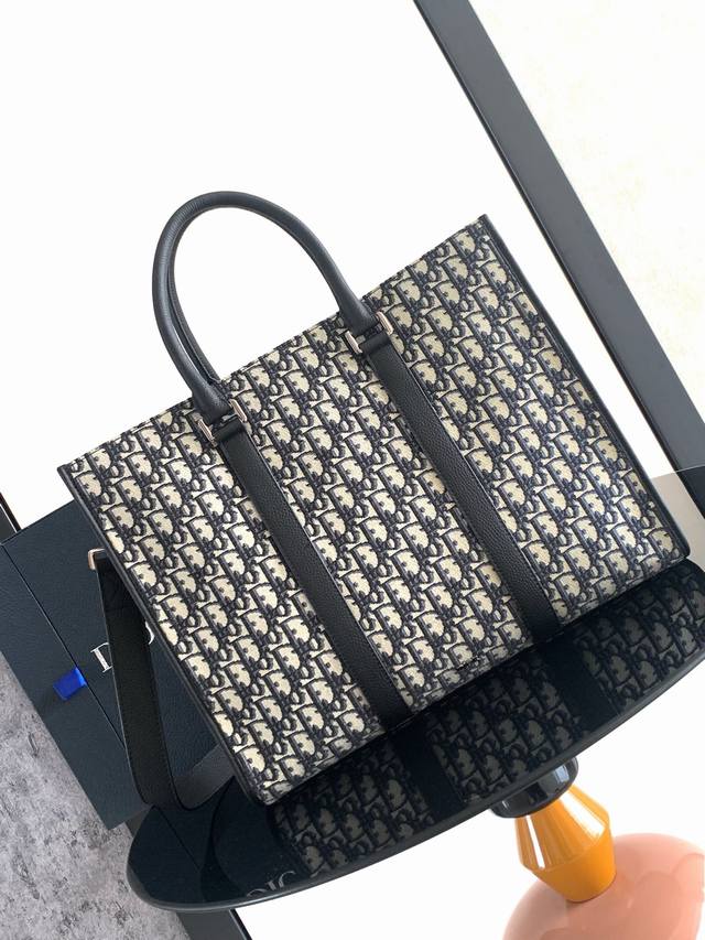 the East-West Bag Exudes Timeless Elegancecrafted In Beige And Black Oblique