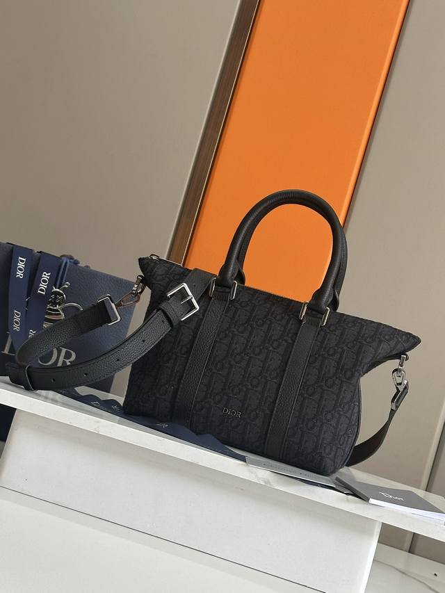 the Weekender 25 Bag Exudes Timeless Elegance And Is Crafted In Beige And Bla