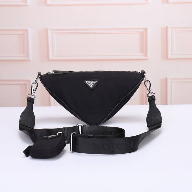 prada-Prada's Latest Triangle Messenger Bag. The Official Website Uses The Or