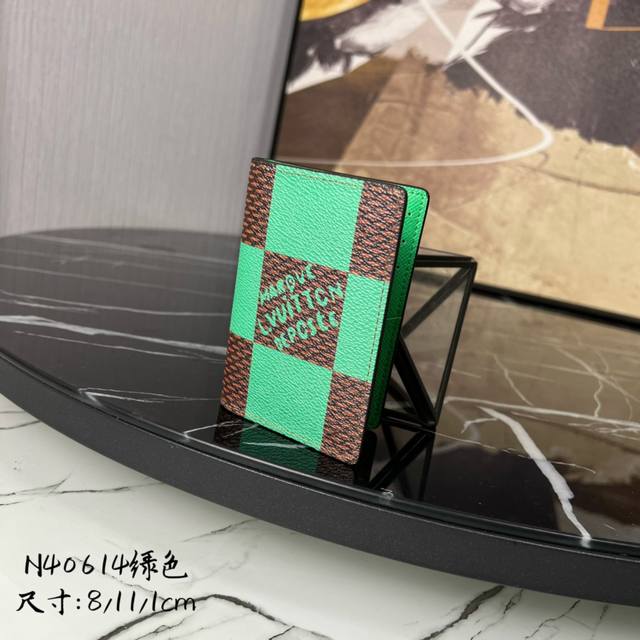 M14109 Green This coin and business card holder is made of Monogram coated canva