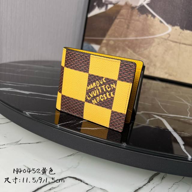 M14358 Blue This Taigarama passport holder is made of Monogram coated canvas in