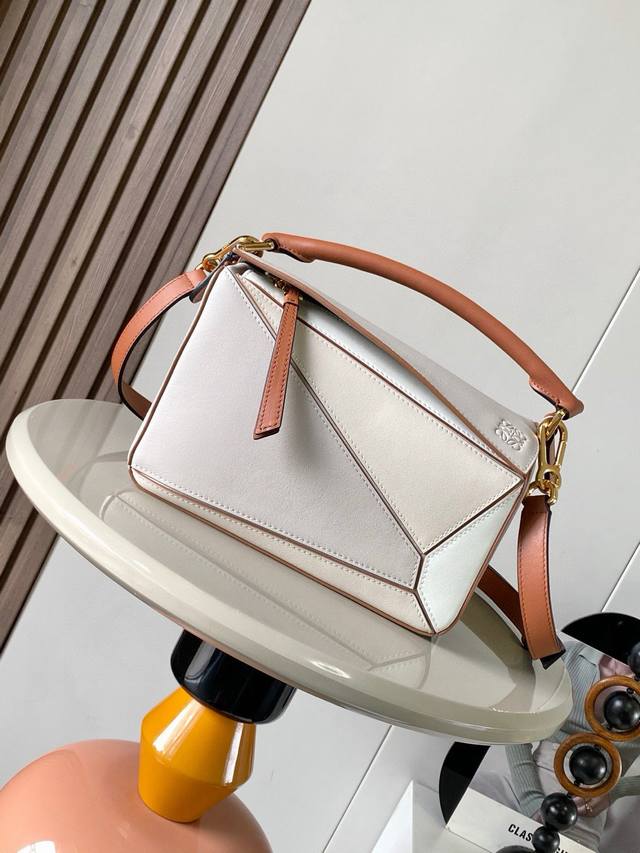The latest briefcase from B&Q, crafted in checkered and Italian tanned leather,