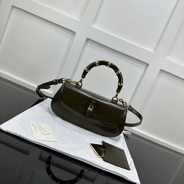 M14526 M25081 M81266 The Trunkie bag combines Monogram canvas and metal rivets,