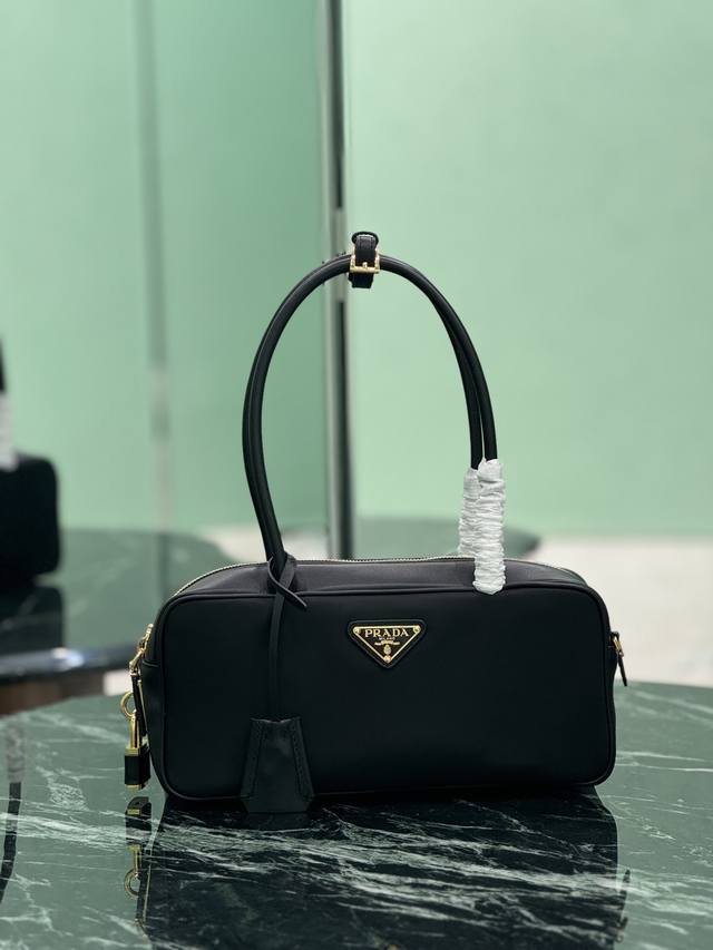 New Lock Bag Small This handbag is crisp and compact, made of recycled nylon Re-