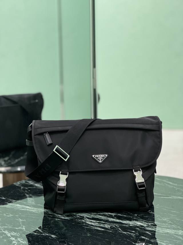 New messenger bag This messenger bag is designed with Re-Nylon recycled nylon fa