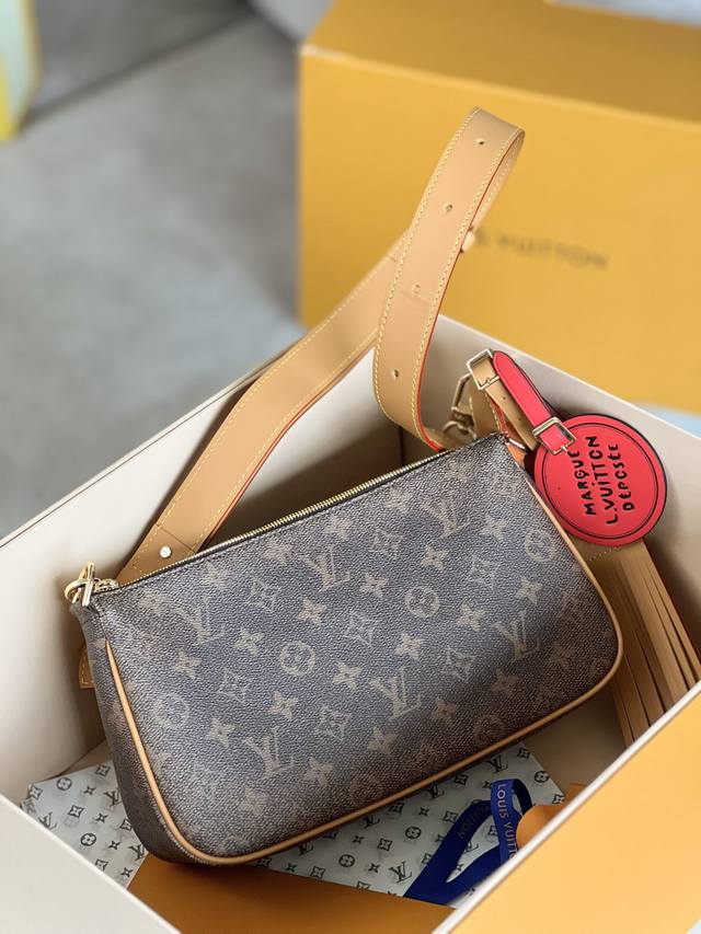 Top original M11623 This Pochette Accessoire Xl handbag presents the time-tested