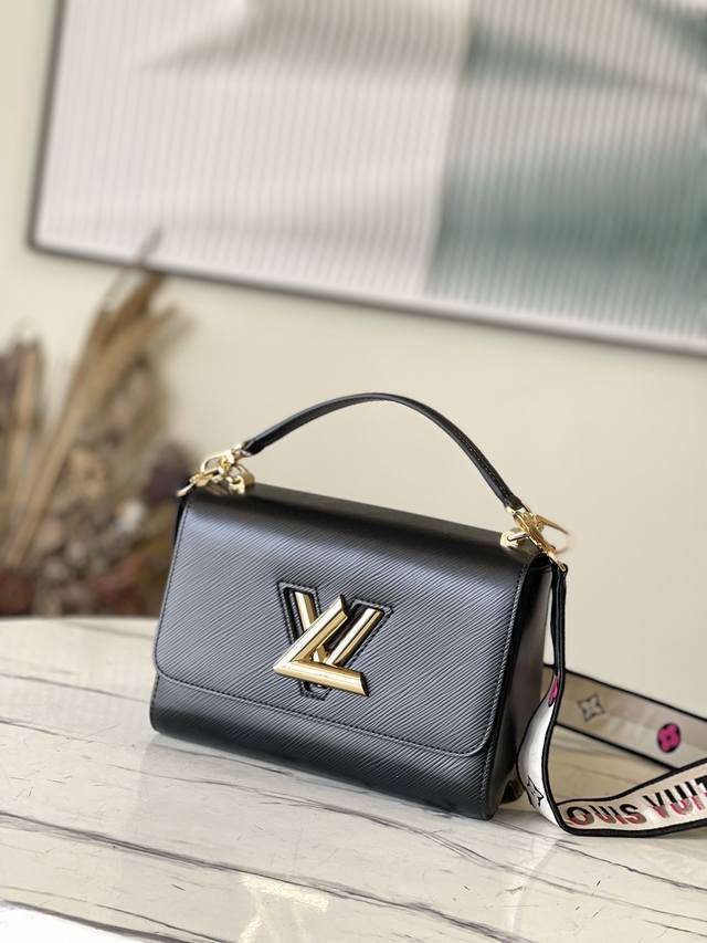 Top-grain leather original M21554 Black This Twist medium handbag is renovated w