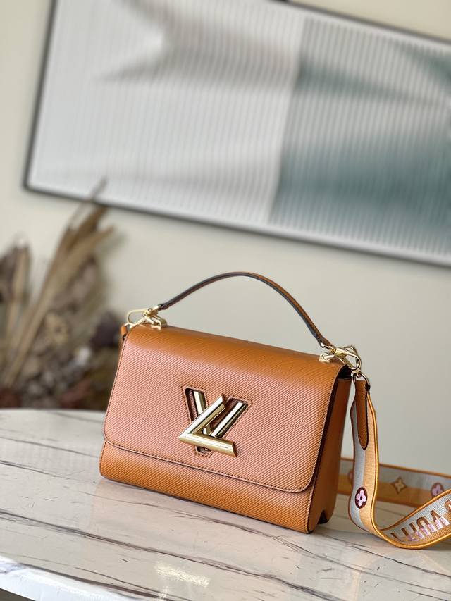 Top-grain leather M21555 Caramel This medium Twist bag is redesigned with a wide