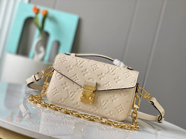 Overseas original 46595 embossed two colors. This Pochette M